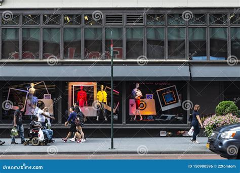 People Walking Down A Street With Shops In New York City Usa Editorial