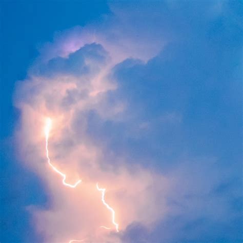 Premium Photo | Lightnings in storm clouds Peals of a thunder and the ...