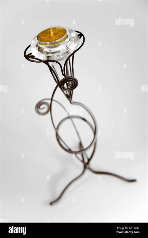 Tea light candle in metal holder candleabra Stock Photo - Alamy