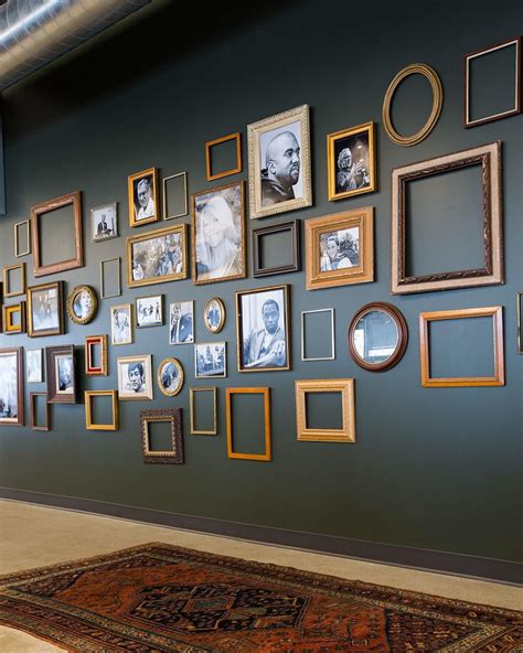 We love the mix of frames on this gallery wall - some empty, some full ...