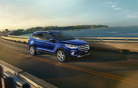 Download Stunning Ford Escape On A Scenic Mountain Road Wallpaper