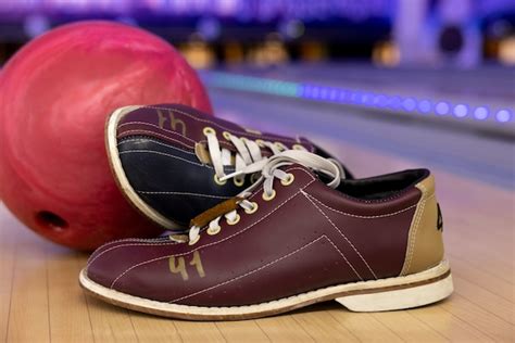 Free Photo | Bowling balls and shoes arrangement