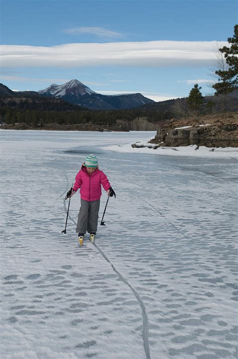 A Young Girl Cross Country Skiing Photograph by Kennan Harvey - Fine ...