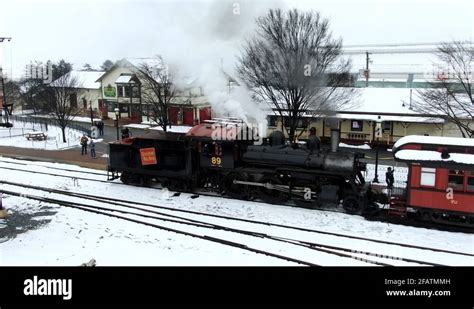 Aerial conductor on a restored steam-powered train hand signals passengers Stock Video Footage ...