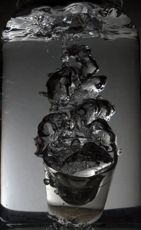 Shot Glass Dropped In Water Stock Photo Image Of Swirling Falling