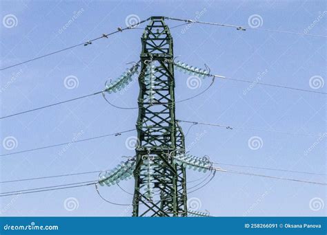 Metal Electric Towers Under A Blue Sky High Voltage Lines And Power