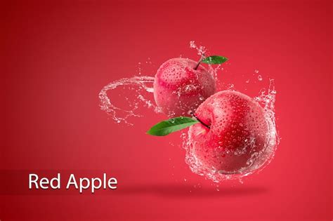 Premium PSD | Water splashing on Fresh Red apple on red background.