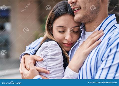 Man And Woman Couple Smiling Confident Hugging Each Other At Street