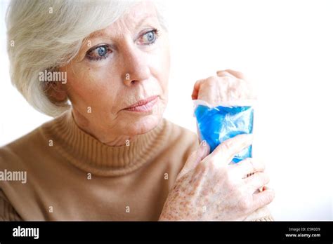 Woman Using A Hot Cold Gel Pack Treatment To Releive Pain Stock Photo Alamy