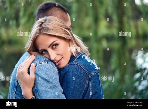 Young Beautiful Woman Hugging Her Boyfriend With Love Outdoors Caucasian Couple In Park