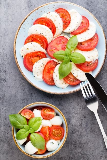 Premium Photo Classic Caprese Salad Mozzarella Tomatoes And Basilikum