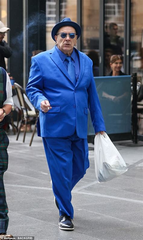 Sex Pistols John Lydon Wears An Eye Catching Blue Suit As He Arrives