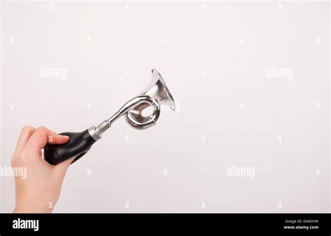 Hand Holding The Vintage Manual Air Horn On White Background Stock