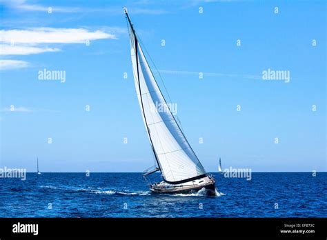 Sailing Ship Yachts With White Sails In The Open Sea Stock Photo Alamy