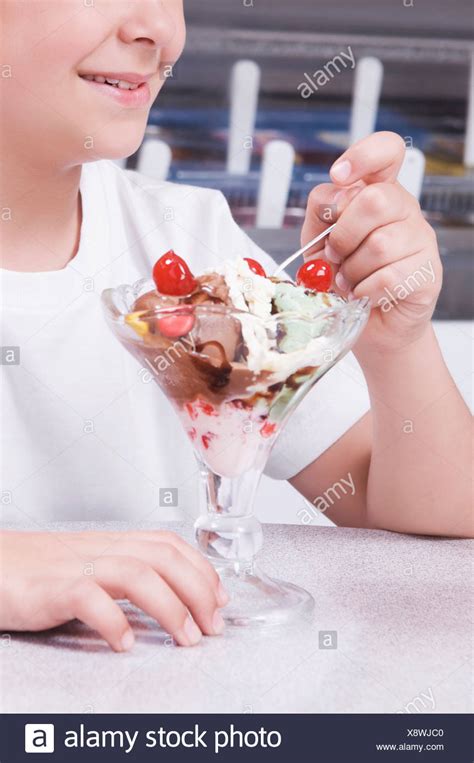 Child Eating Ice Cream Sundae Stock Photos & Child Eating Ice Cream ...