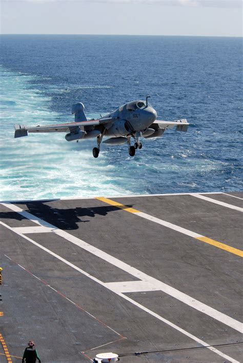 Stock Photography Image A Jet Landing On An Aircraft Carrier S Flight Deck