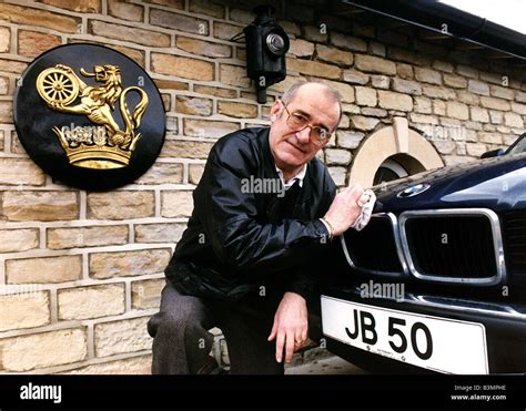 Jim Bowen Comedian TV Presenter polishing his BMW car Stock Photo - Alamy