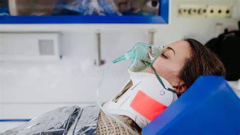 Close Up Of Woman Patient In Ambulance Vehicle After Serious Accident