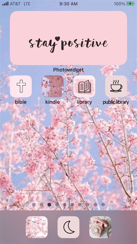 an iphone screen with the text stay positive on it and pink flowers in ...