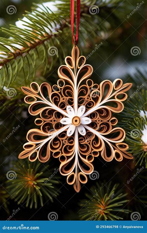 A Paper Snowflake Hanging From A Christmas Tree Paper Quilling Stock