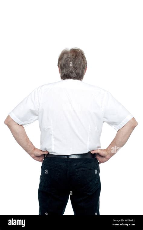 Back Pose Of A Senior Man Standing With Hands On His Waist All On