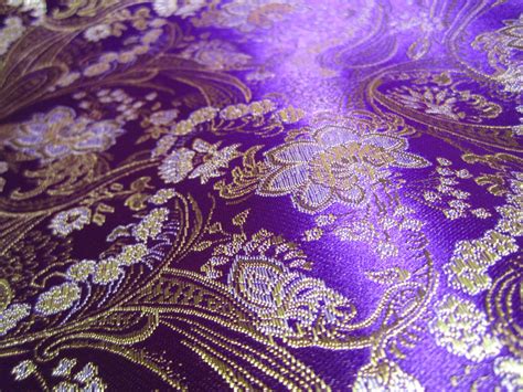 Chinese Brocade Fabric In Royal Purple With A Floral Pattern In Gold