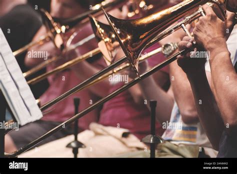 Musicians playing trombone in a brass band Stock Photo - Alamy