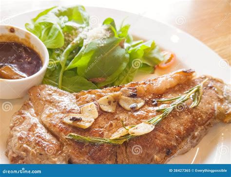 Beef Steak On Wooden Table Stock Image Image Of Medium