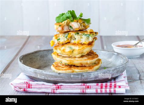 Prawn And Sweetcorn Fritters With Sweet Chilli Sauce Stock Photo Alamy