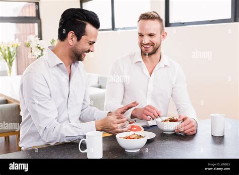 Smiling Gay Couple Having Breakfast Stock Photo Alamy