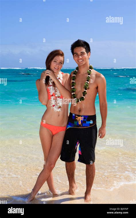 young couple at the beach in hawaii Stock Photo - Alamy