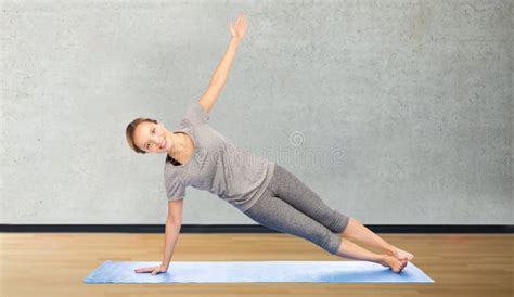 Woman Making Yoga In Side Plank Pose On Mat Stock Image Image Of