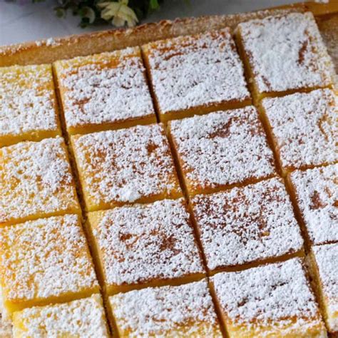 Irresistible Lemon Bars: A Crowd-Pleasing Dessert - Veena Azmanov Kitchen