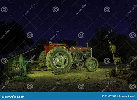 Tractor Working In The Fields Under The Night Sky Stock Image Image