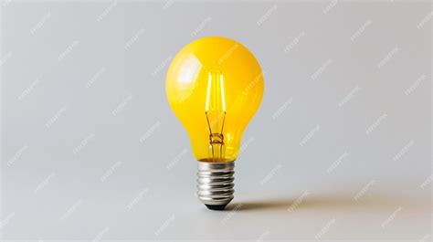 Premium Photo | Yellow Bright Light Bulb on a Clean White Background