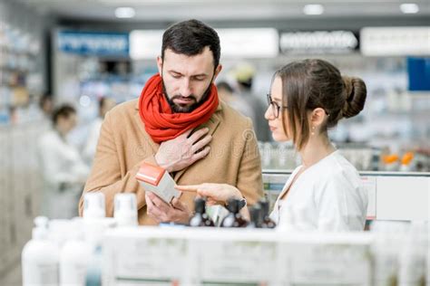 Pharmacist With Client In The Pharmacy Store Stock Photo Image Of