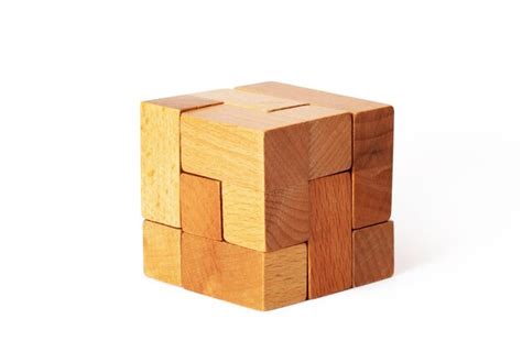 Premium Photo | Wooden cube puzzle with clipping path