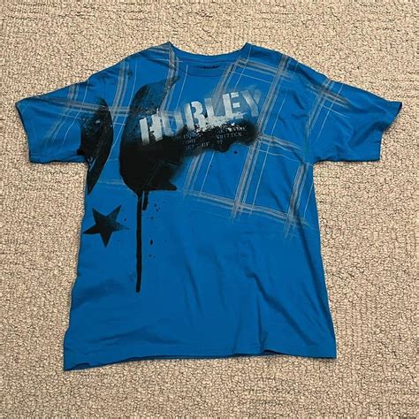 Hurley shirt. Tagged large but the length is 30... - Depop