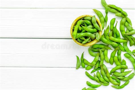 Vegan Food With Green Soybeans Or Edamame On White Wooden Background