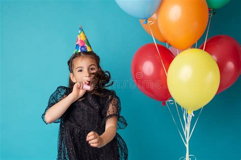 Cheerful Little Girl With Balloons On The Color Blue Background Happy