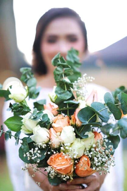 Premium Photo Close Up Of Woman Holding Flower Bouquet