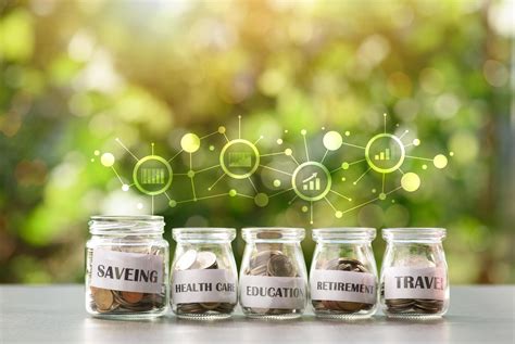 5 Glass Jars With Coins Arranged In A Natural Background Money Saving