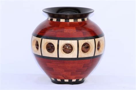 A Segmented Wooden Vase Made From 305 Pieces Of Bloodwood Gabon Ebony