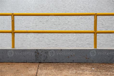 Yellow painted metallic handrail 13070851 Stock Photo at Vecteezy