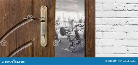 Entrance To Gym In Fitness Club Opened Door With Exercise Bikes Stock