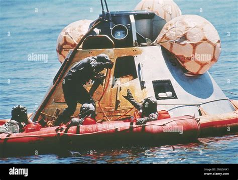 Navy Diver Clancy Hatleberg Standing Holds A Hose After Spraying