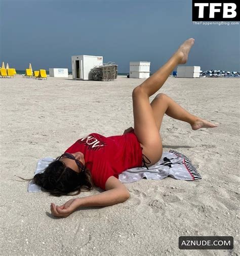 Claudia Romani Sexy Poses Showing Off Her Hot Ass Wearing An AC Milan Shirt On The Beach In