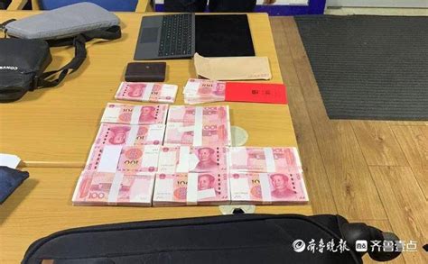 粗心奥迪车主将10万元现金落在停车场，烟台开发区警民联手送还行李箱失主张某