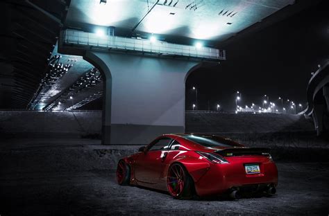 Red Nissan 350Z Boasting Red Buttoms and Liberty Walk Body Kit | CARiD.com Gallery