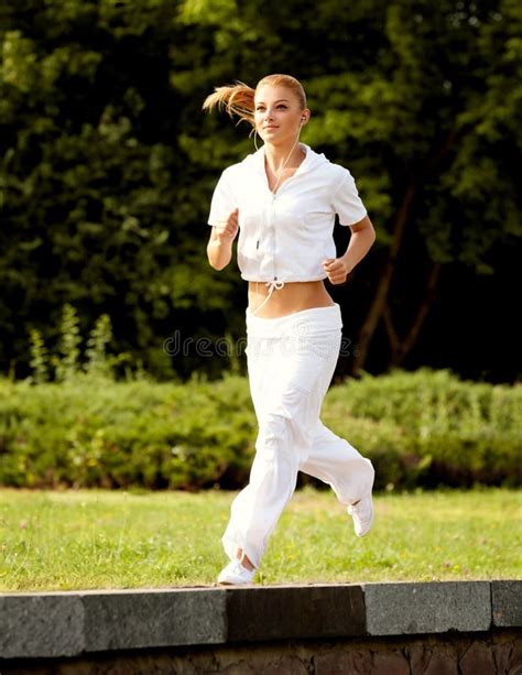 Athletic Runner Training in a Park for Marathon. Fitness Girl Ru Stock ...